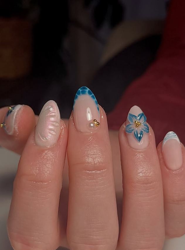Blue floral nail art with pearls
